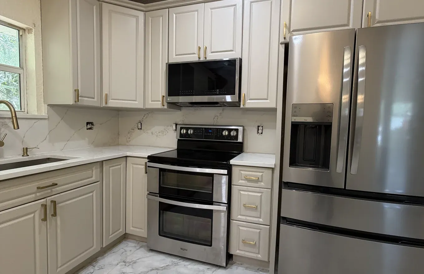 Refreshed kitchen with newly painted cabinets and updated hardware