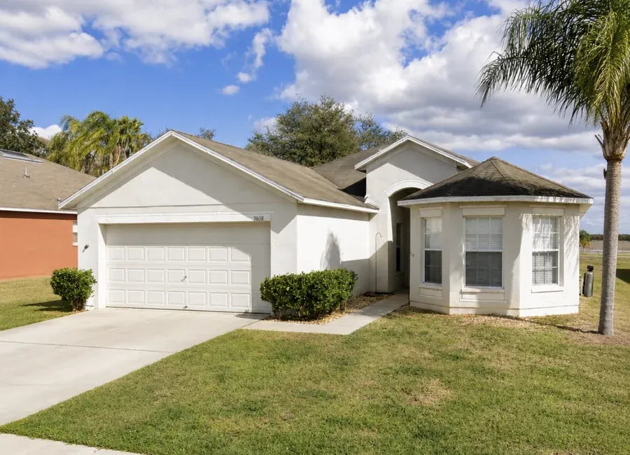 Whole-home exterior freshly repainted with clean trim