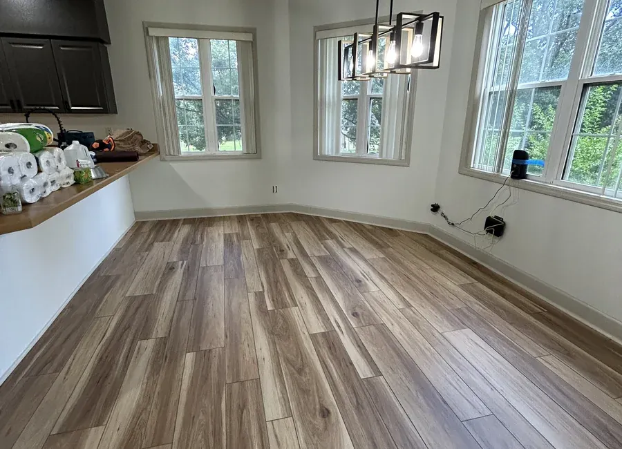 Open-plan living area with new luxury vinyl plank flooring
